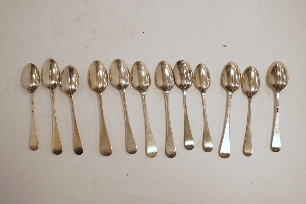 A group of twelve assorted Georgian silver base mark rat tail teaspoons, various dates and makers, indistinct marks, 4.4oz.